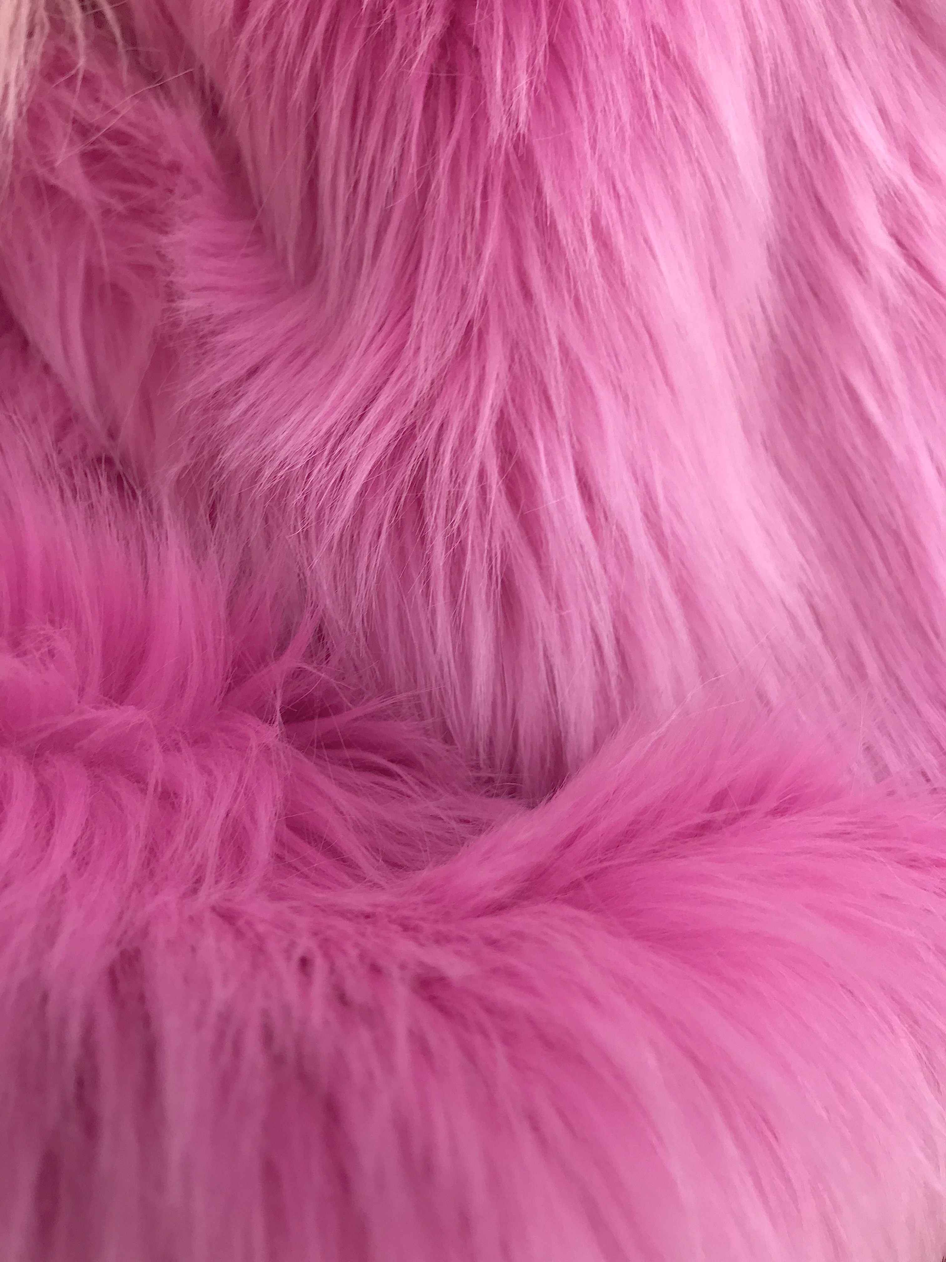 detail of abstract texture background with sweet pink fur, background of  artificial fuzzy fur in pink color, beautiful close up of light pink fake  fur background for decoration Stock Photo